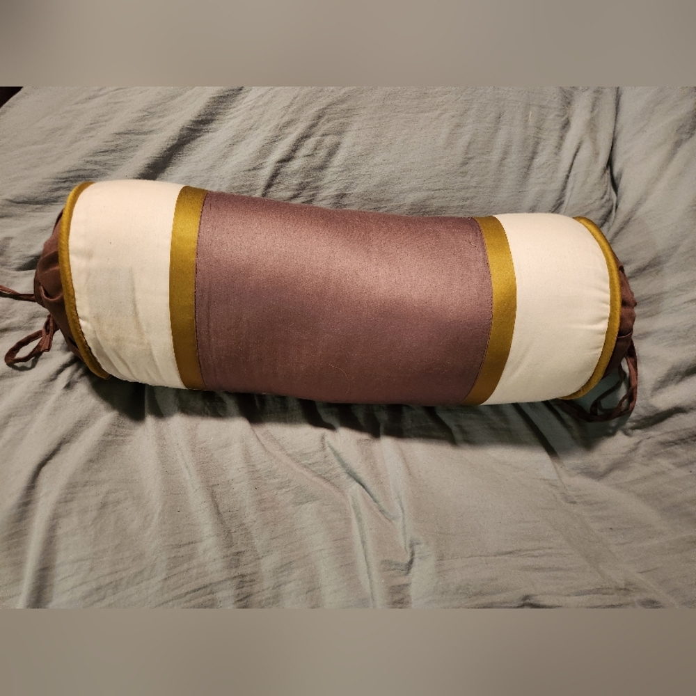 Brown,  white and green decorative toss pillow.
